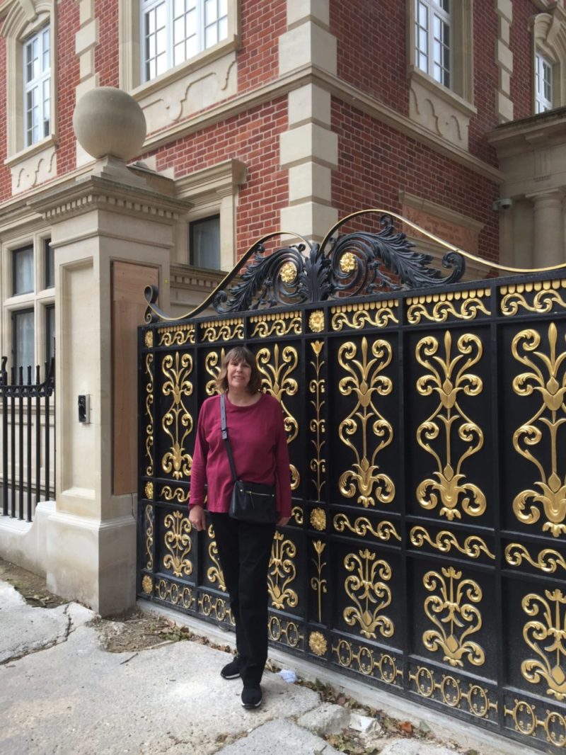Councillor Maggie Carman outside the new gatss at 51 Palace Court