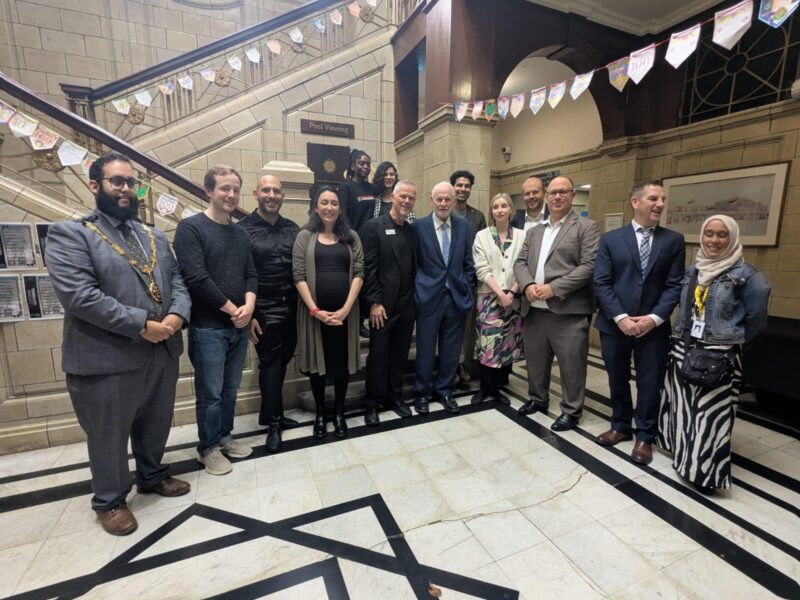 Photo of people attending the 100 year celebrations at the Porchester Centre